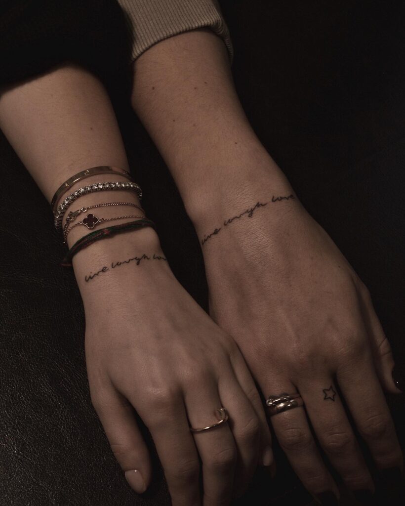 Matching Live Love Laugh Script Lettering on Outer Wrists: Friendship Trio
