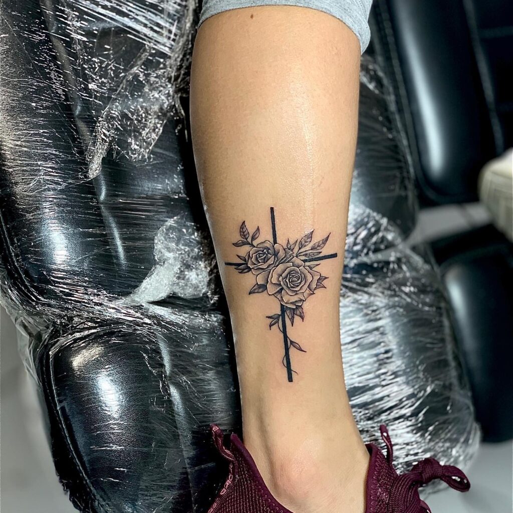 Meaningful Lower Leg Tattoos Roses and Crosses Representing Faith and Growth