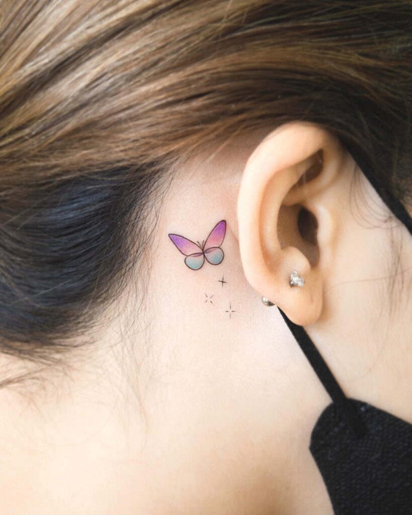 Meaningful small glass butterfly tattoo behind the ear personal reflection