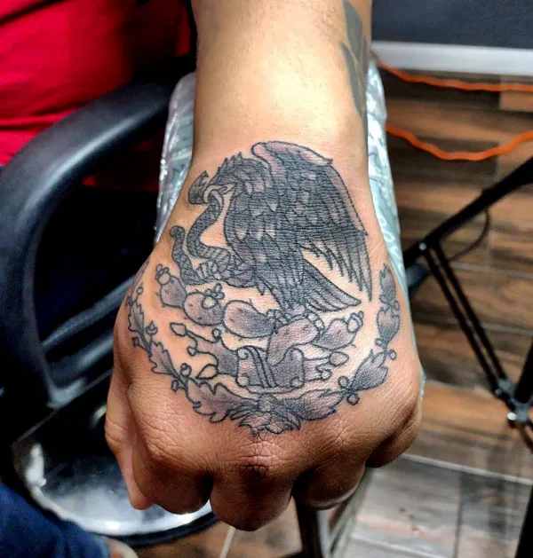 Mexican eagle tattoo on hand
