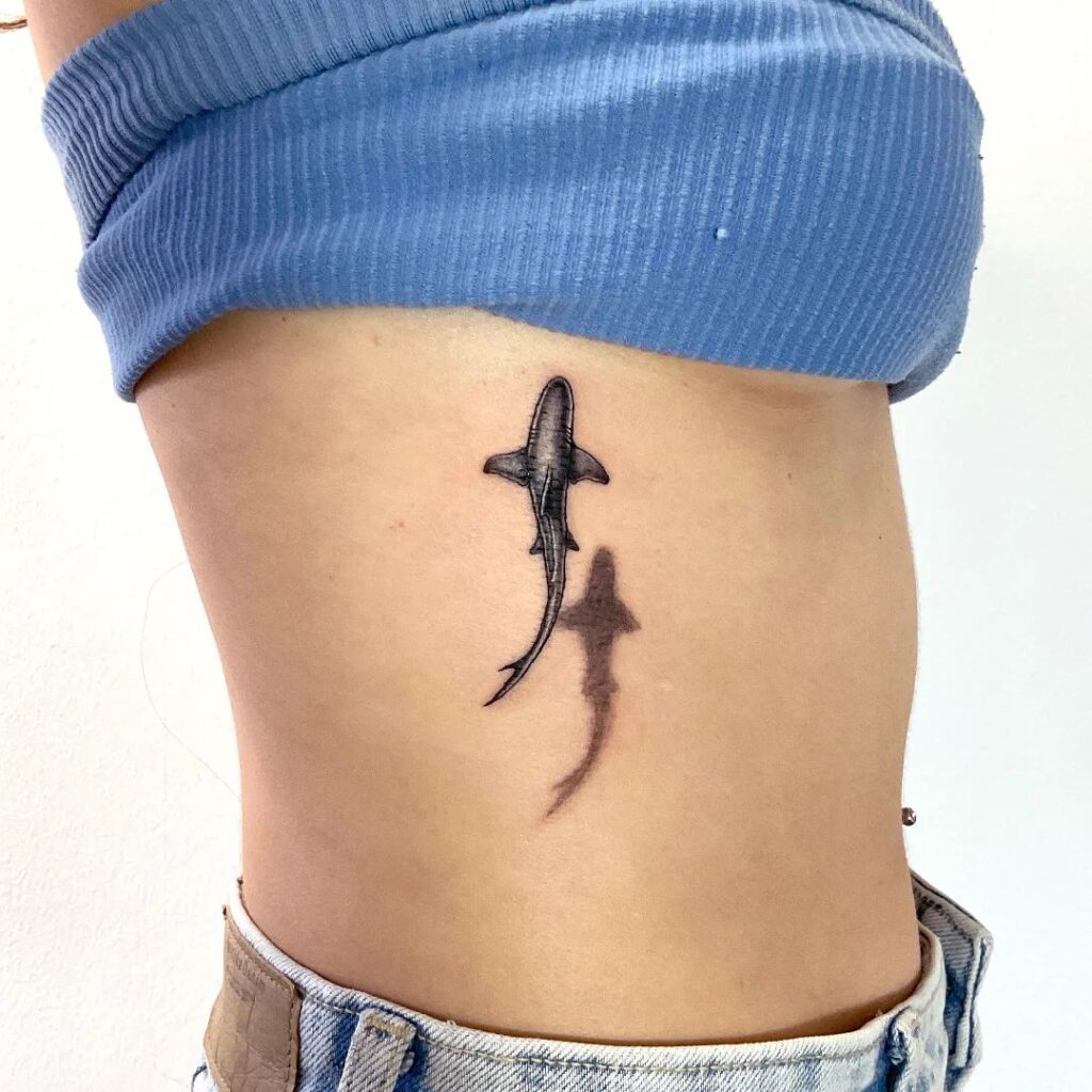 Micro realistic 3d shark tattoo on the rib detailed top view shark ink
