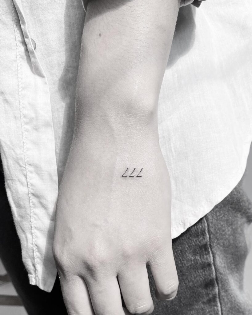 Mini 777 Tattoo on the Hand for a Delicate Touch: Handy Triple 