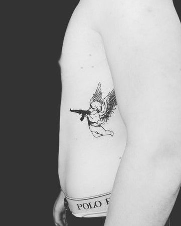 Mini angel with gun tattoo for men Mini angel with gun tattoo for men