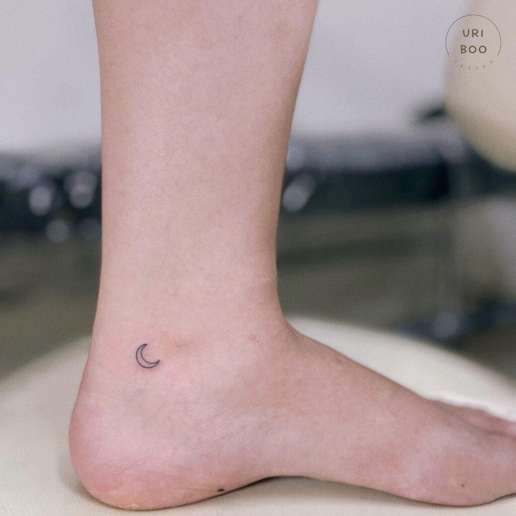 Mini Crescent Moon Tattoo Near the Ankle, a Subtle Celestial Accent: Lunar Whimsy