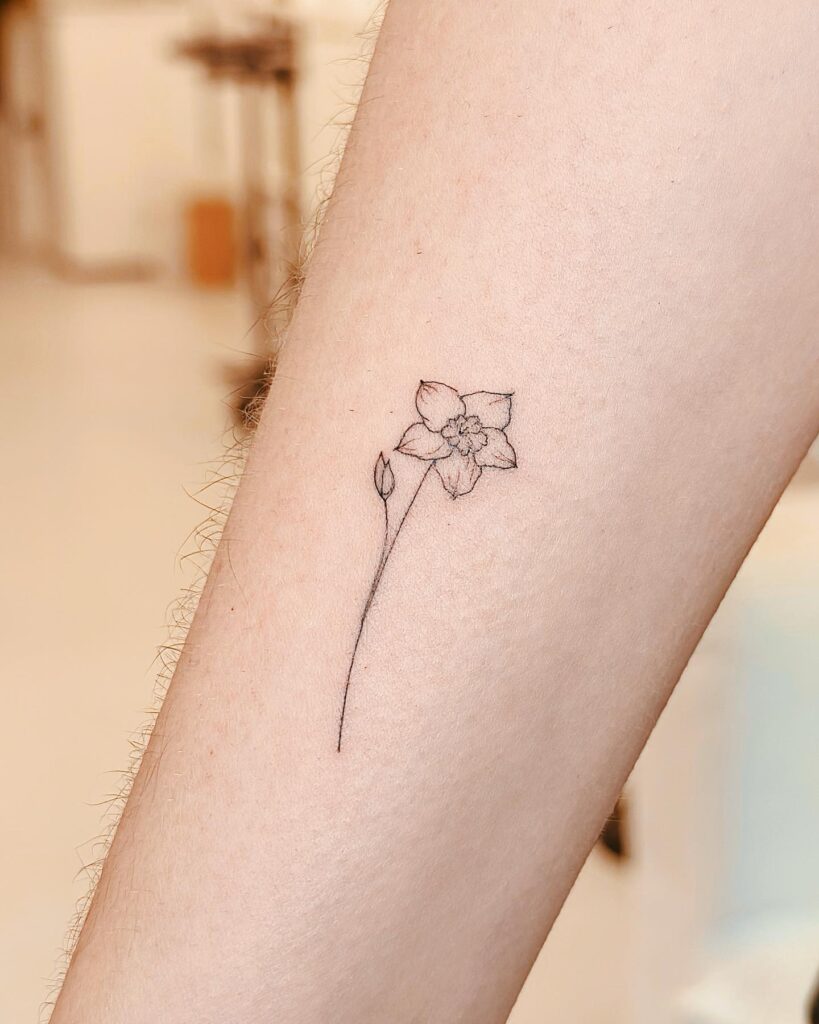 Mini Flower Tattoo Adding a Touch of Nature to the Side of the Forearm: Petite Bloom