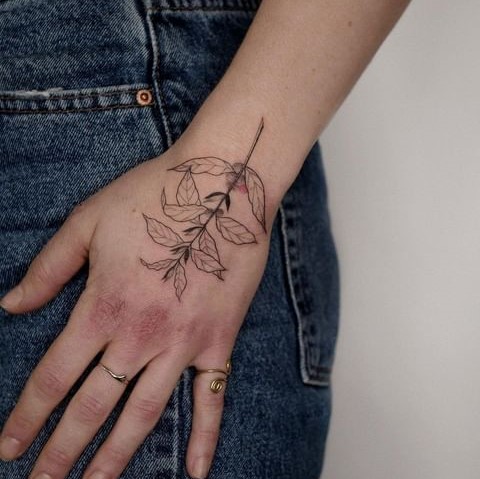 Minimal Coffee Plant Tattoo Design on the Back of the Hand