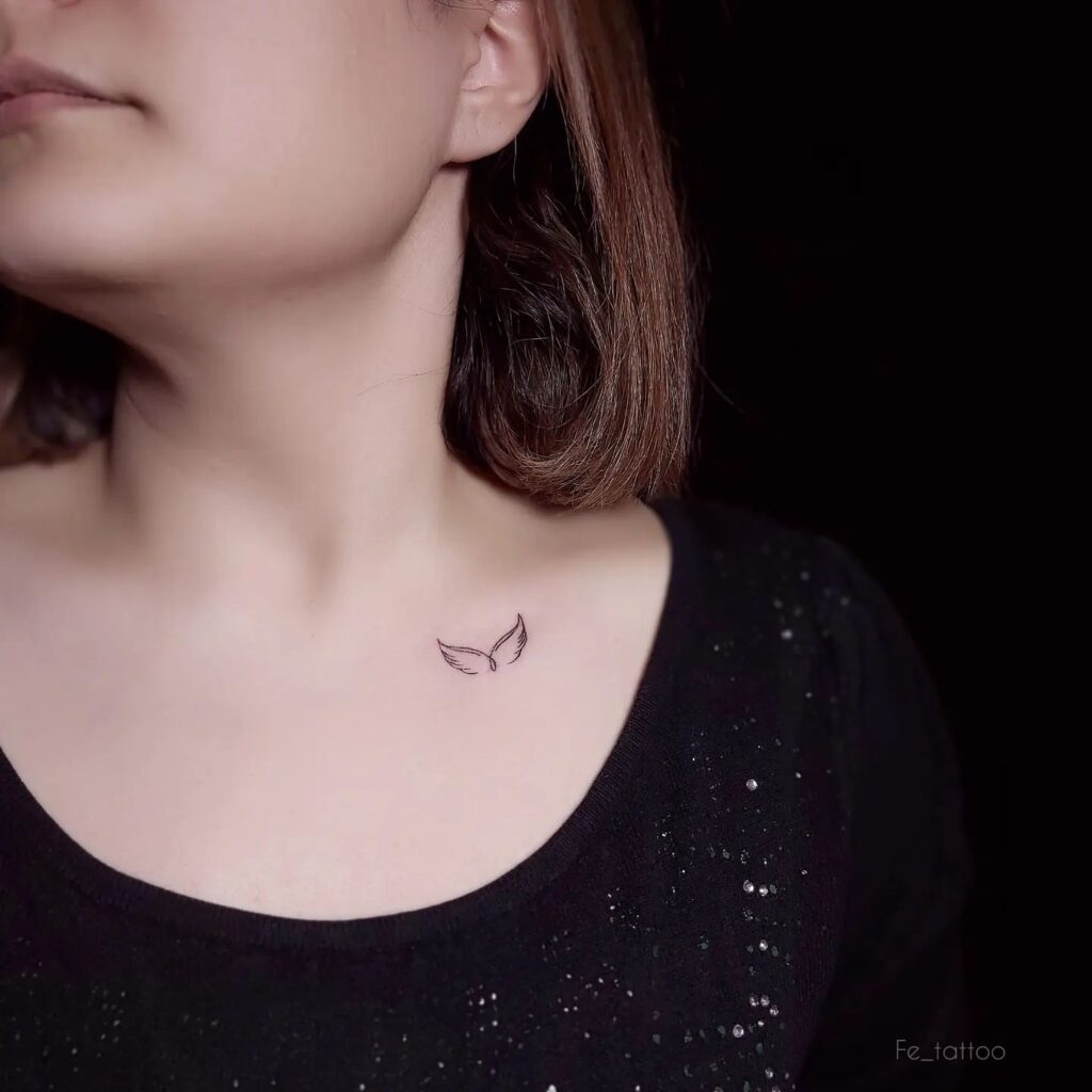 Minimal Light Wing Tattoo on the Collarbone, a Dainty Accent: Delicate Flight