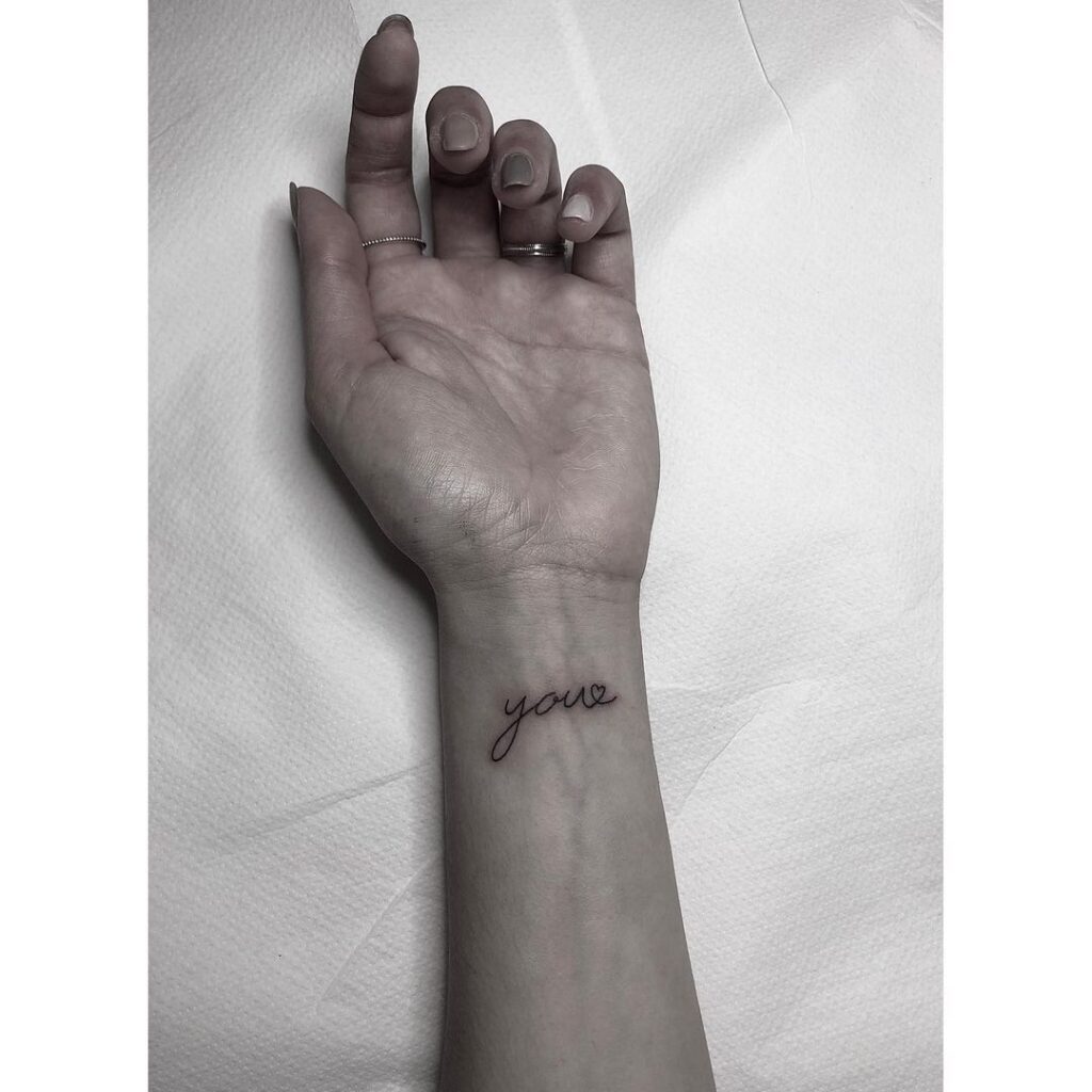 Minimal you lettering inner wrist outline heart symbol tattoo