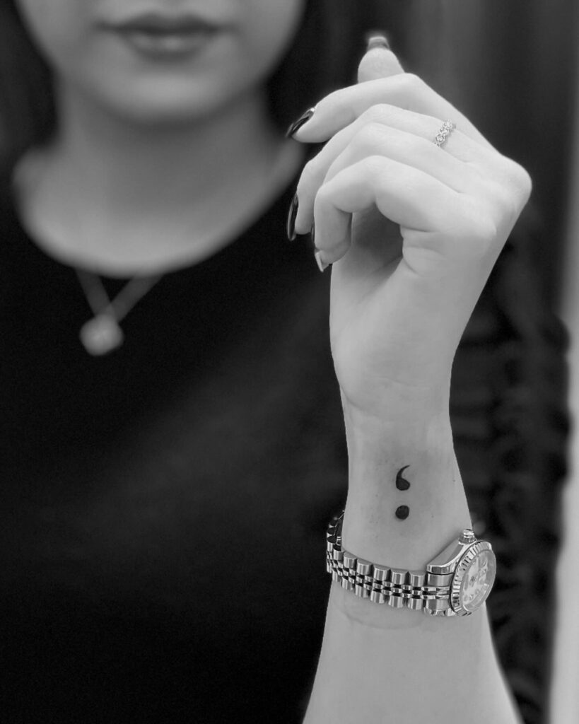Minimalism in a Semicolon Tattoo on the Side of the Wrist: Less is More
