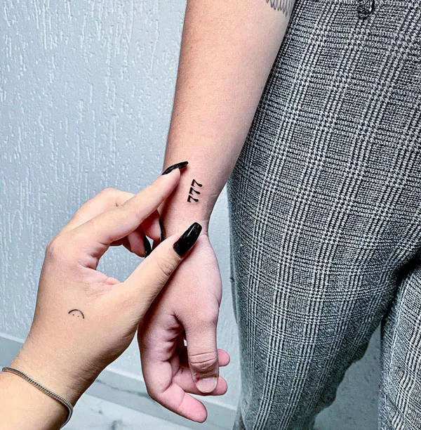 Minimalist 777 tattoo