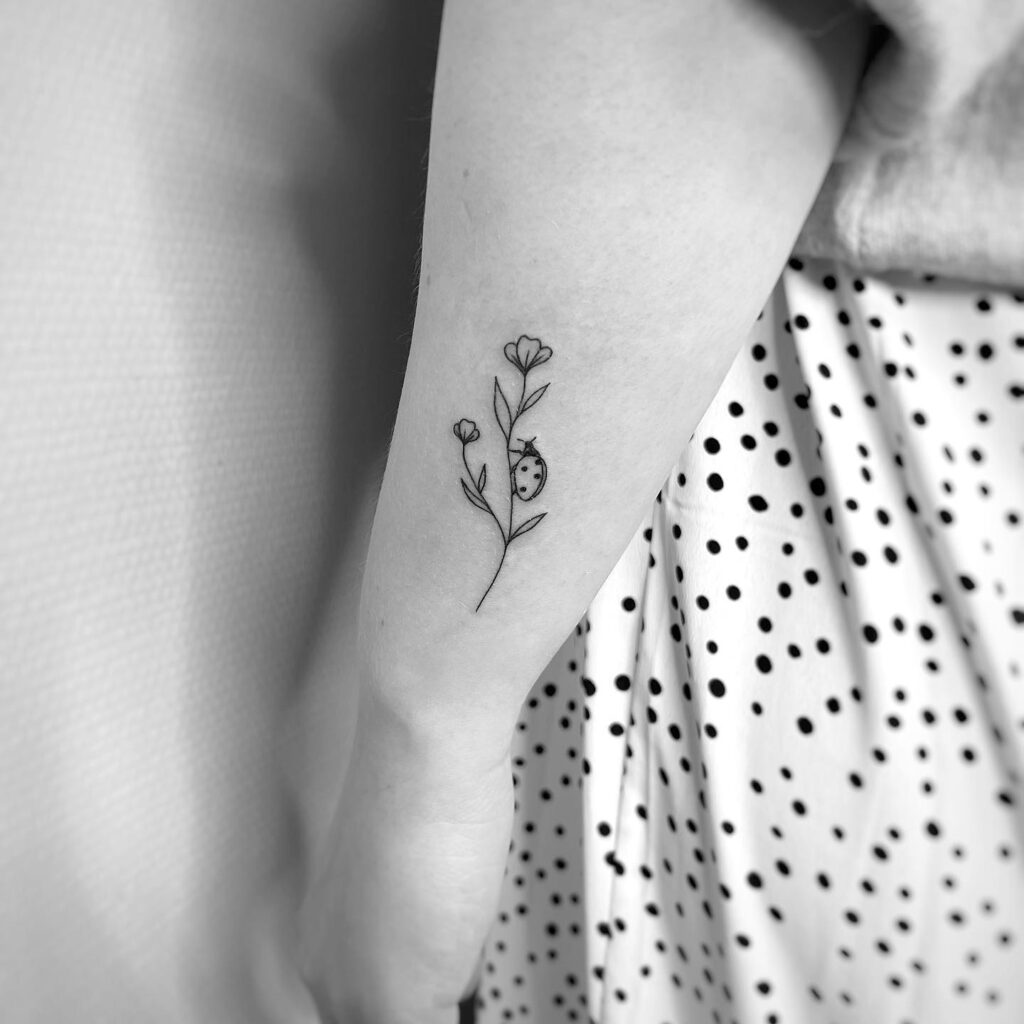 Minimalist charm outline simple small ladybug and flower tattoo