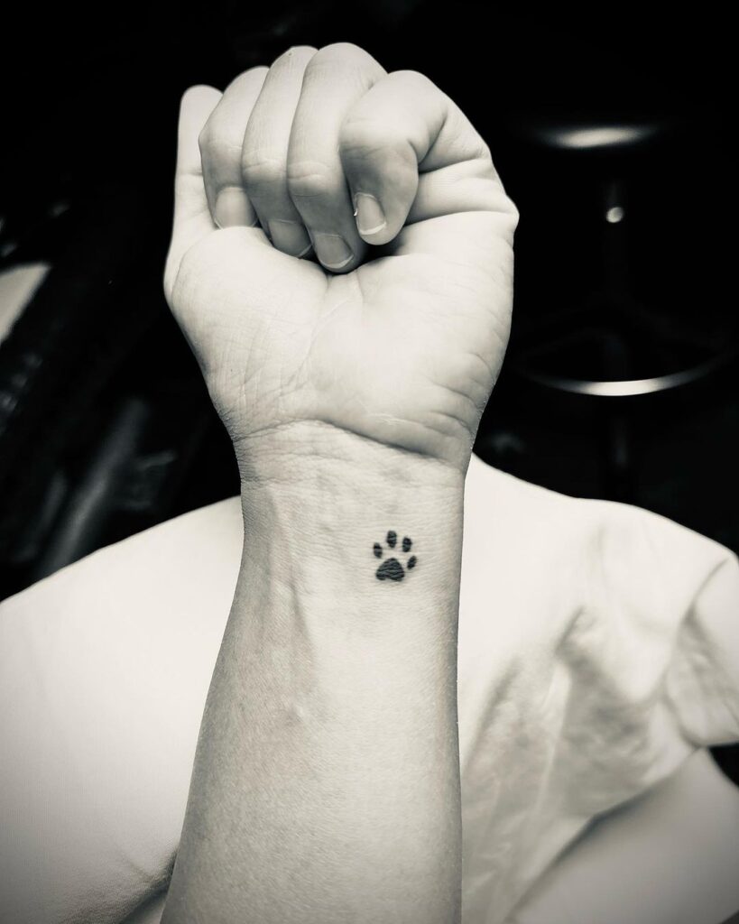 Minimalist charm small black dog paw on the inner wrist