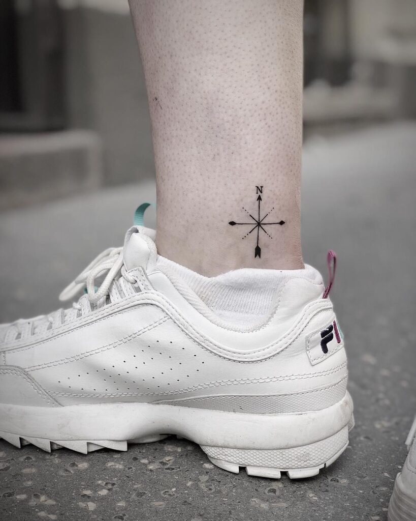 Minimalist direction little compass above the ankle tattoo