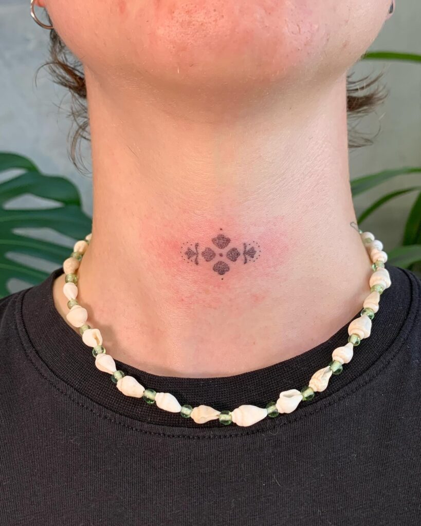 Minimalist Dotwork Lower Neck Tattoo Subtle and Elegant Design