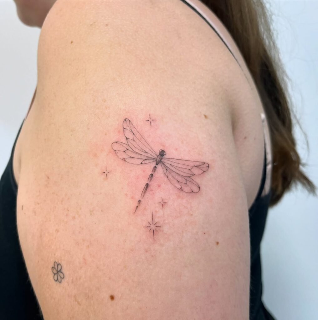 Minimalist Dragonfly Tattoo with Sparkles and Floral Accents