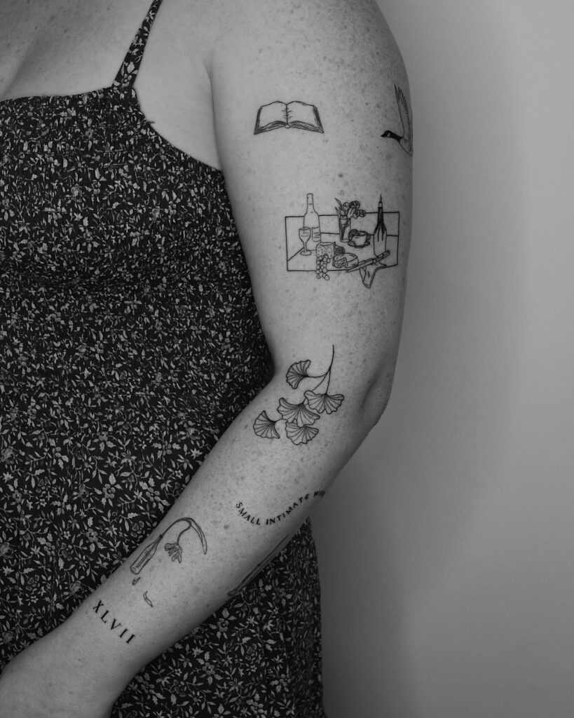 Minimalist fine-line blackwork tattoo collection with literature and nature symbols