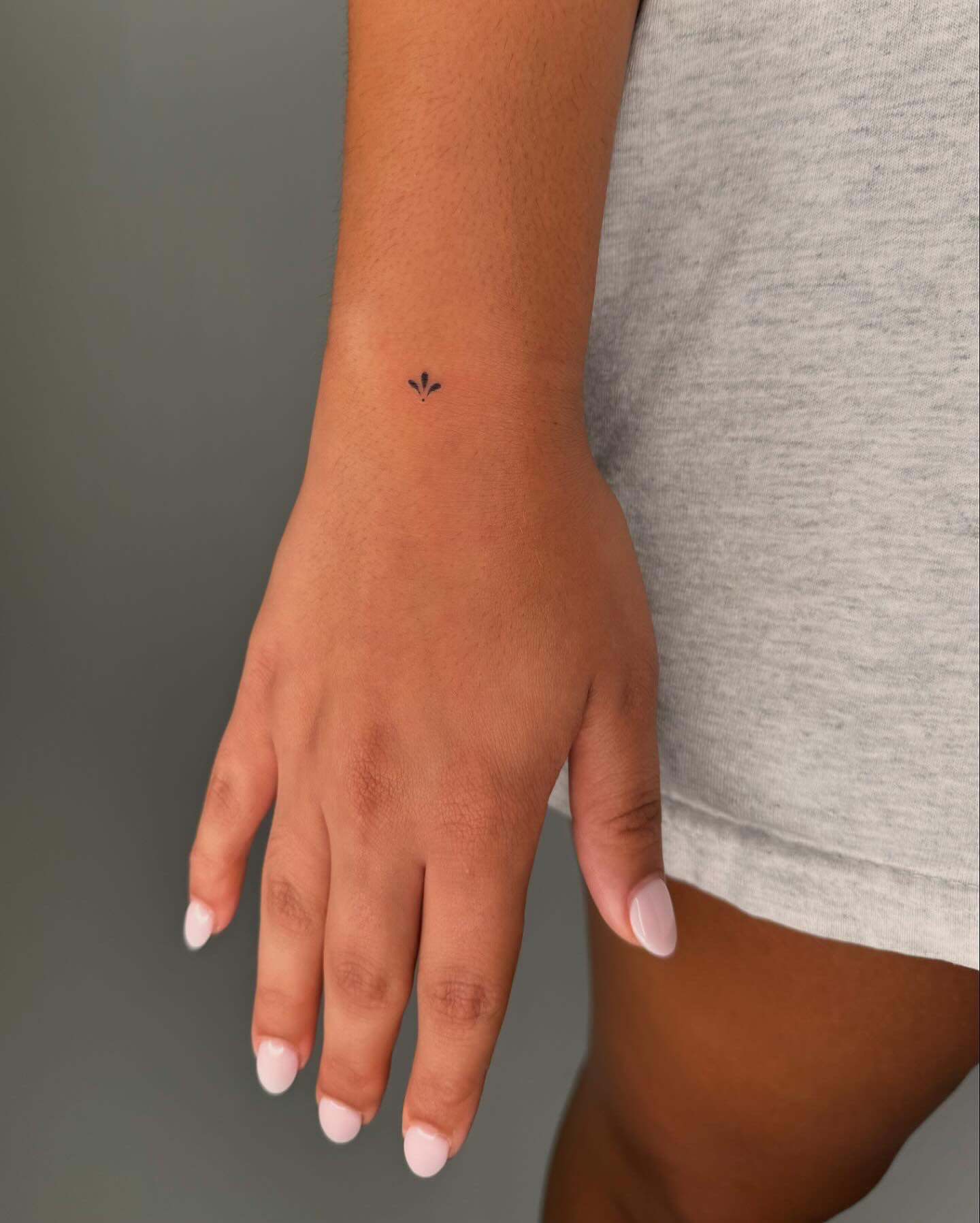 Minimalist Floral Wrist Tattoo Elegant and Subtle Abstract Design