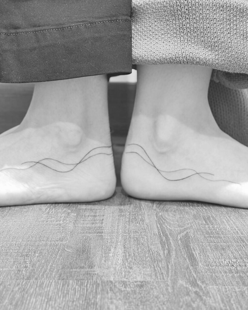 Minimalist Flowing Line Tattoos for Mother and Daughter A Lifelong Connection
