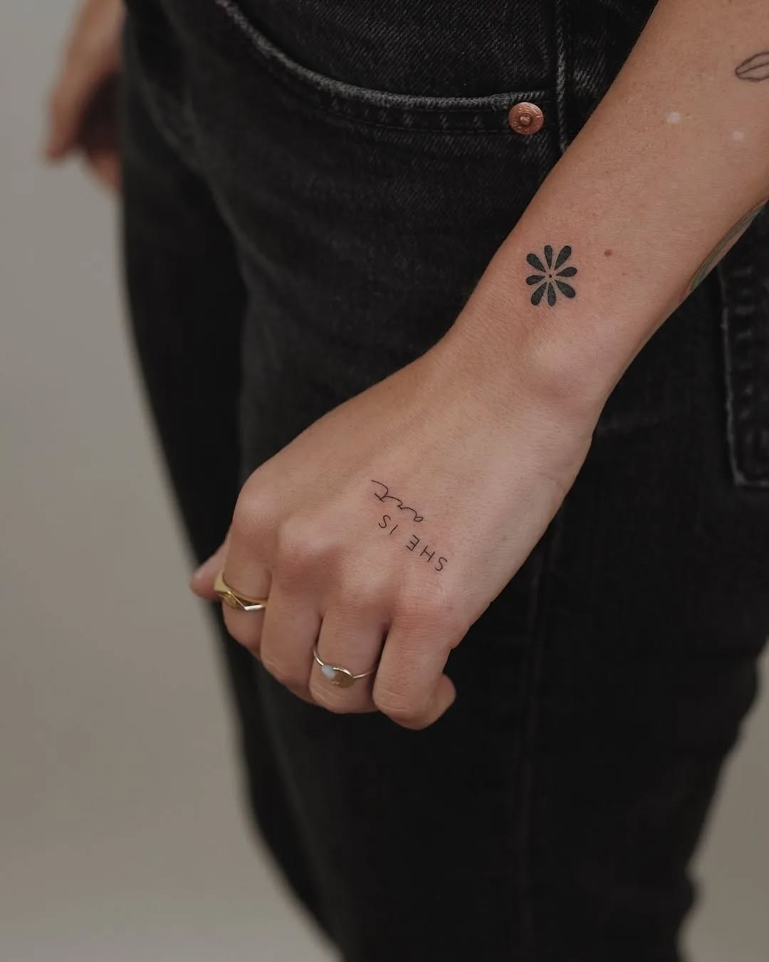 Minimalist Geometric Flower & Fine-Line Text Tattoo Elegant Wrist Design
