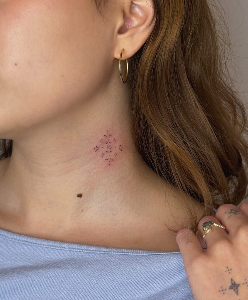 Minimalist geometric mandala tattoo for the side of the neck