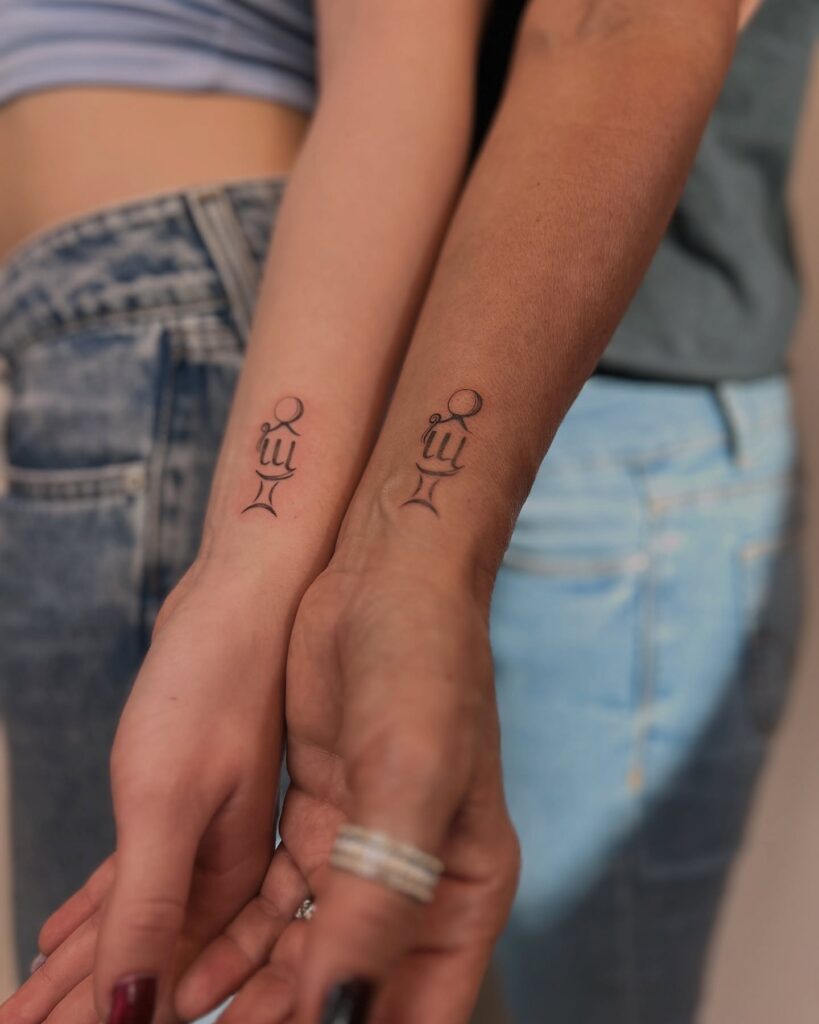 Minimalist Mother and Child Symbol Mother Daughter Tattoos for a Deep Bond