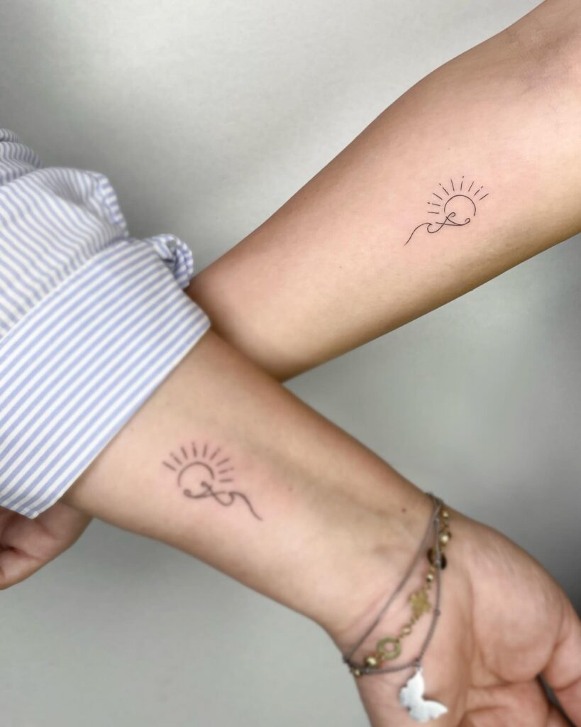 Minimalist Mother and Daughter Tattoos with Line Art Symbolizing Eternal Love