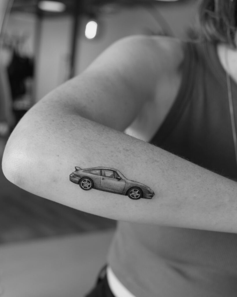 Minimalist Porsche 911 Tattoo with Fine Linework on Inner Forearm – Car Tattoo Ideas