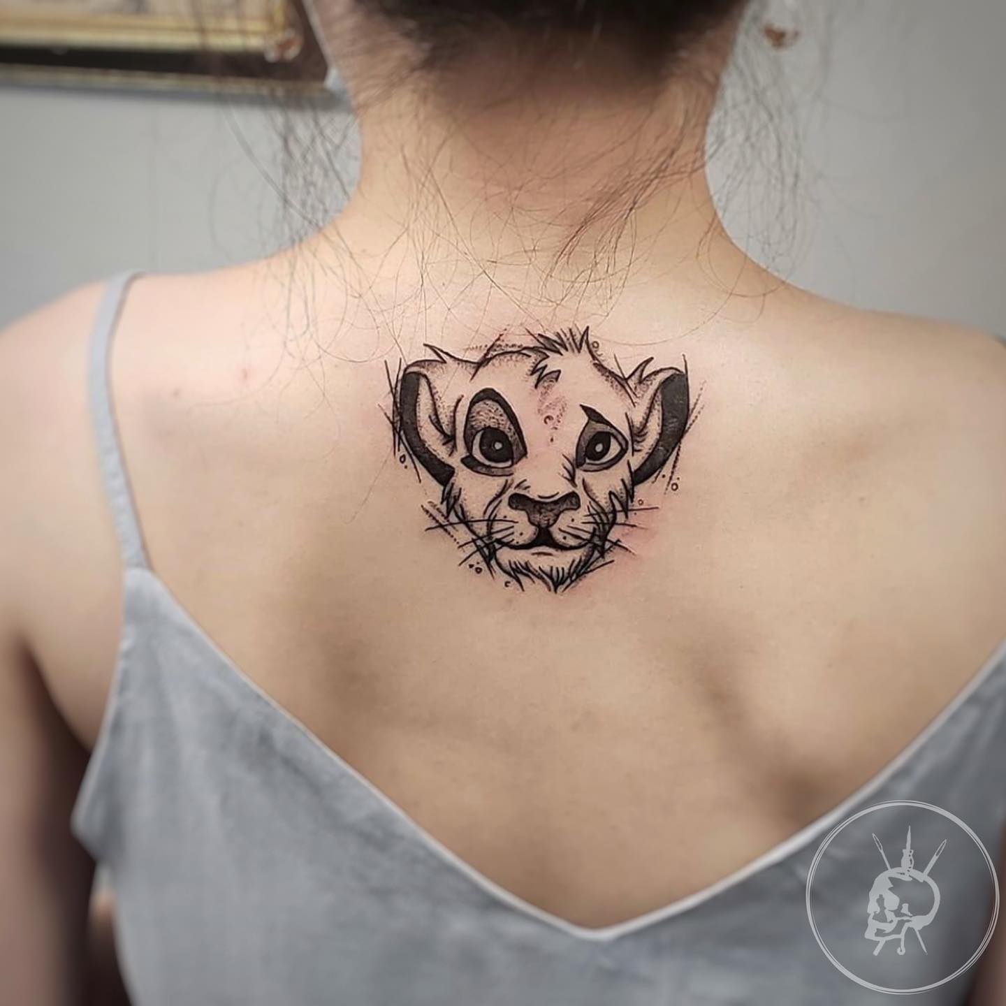 Minimalist sketch-style Simba tattoo from The Lion King for Disney fans who love elegant and expressive black ink designs
