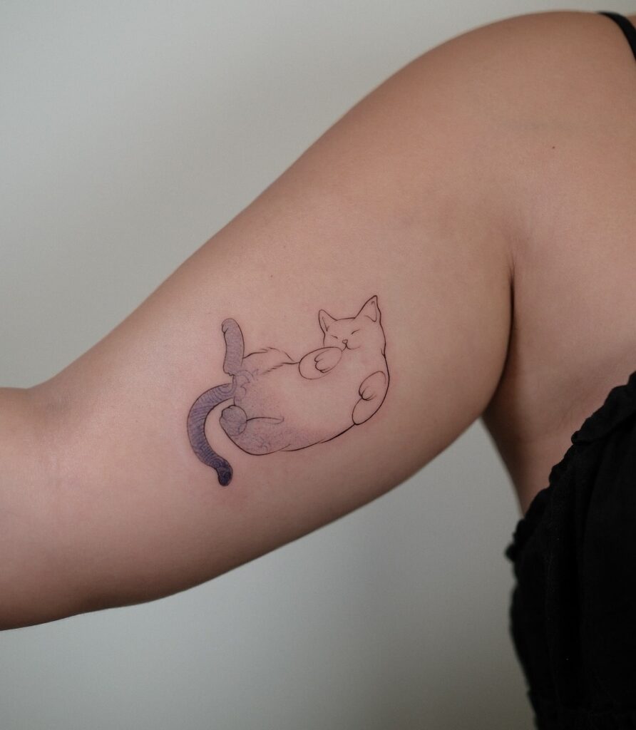 Minimalist sleeping cat tattoo with purple tail shading