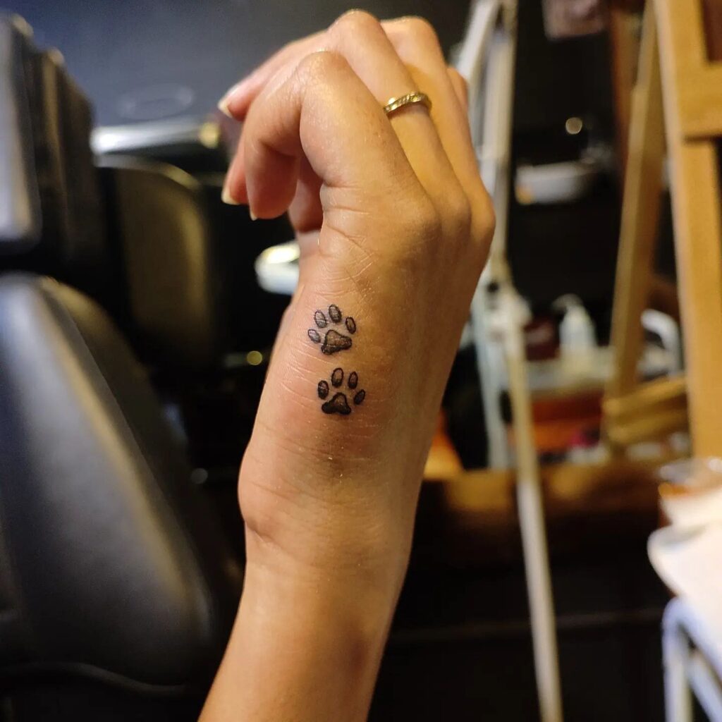 Minimalist Tattoo with Two Dog Paws on the Side of the Hand: Hand Pawistry
