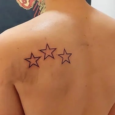 Minimalist three-star outline shoulder tattoo ideas