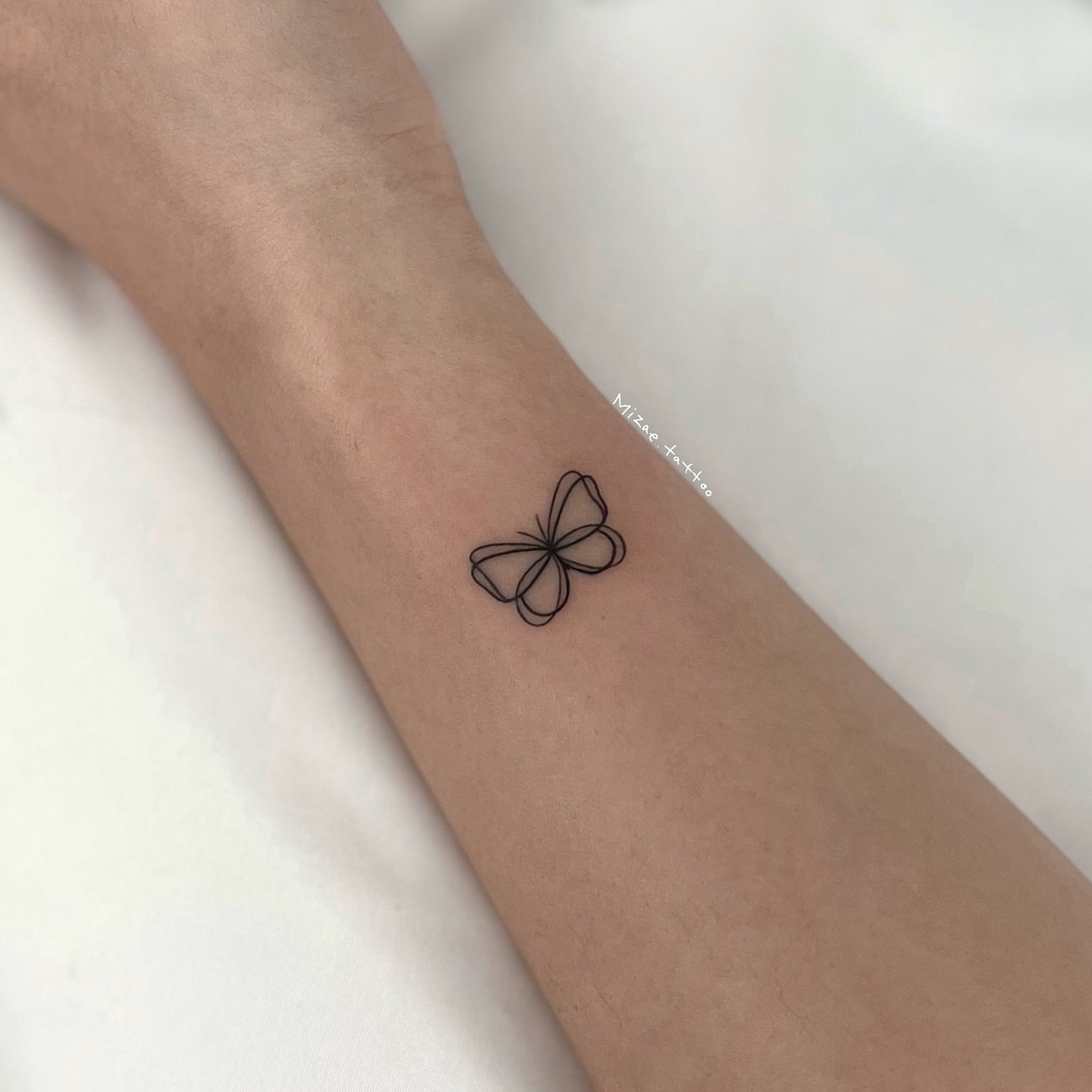 Minimalist wreath tattoo on wrist elegant timeless design