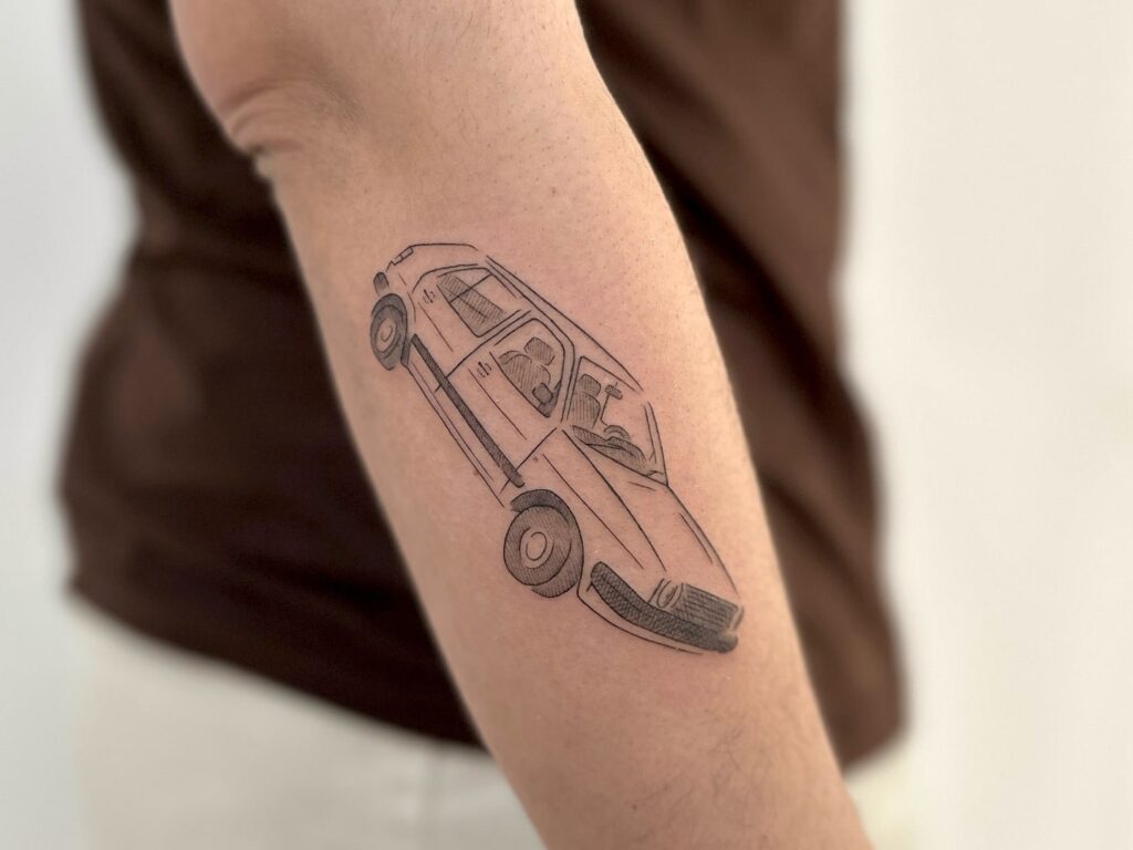 Minimalistic Line Art Vintage Car Tattoo with Clean Lines on Outer Forearm – Car Tattoo Ideas