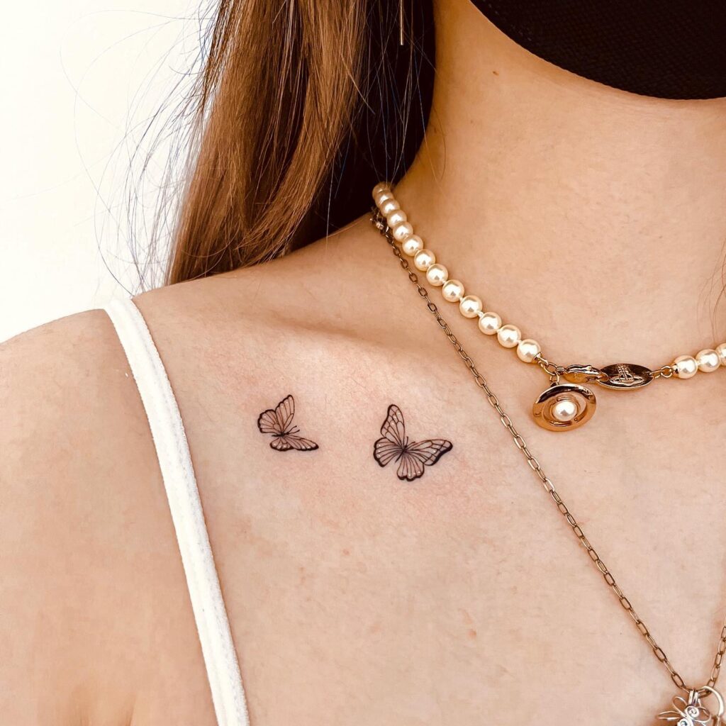 Minimalistic two butterfly collarbone tattoo, graceful and feminine butterfly duo