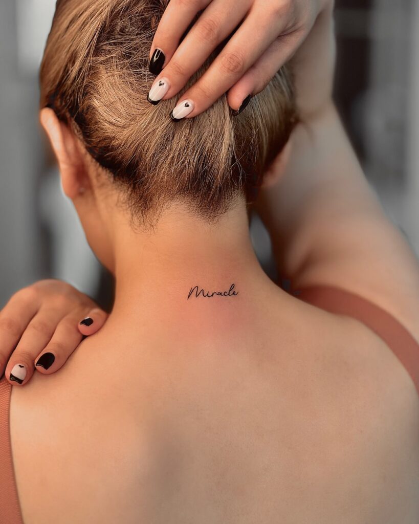 Miracle Cursive Script Neck Tattoo Elegant Minimalist and Meaningful