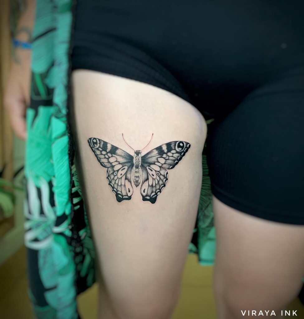 Monarch butterfly tattoo in black and white on thigh majestic presence