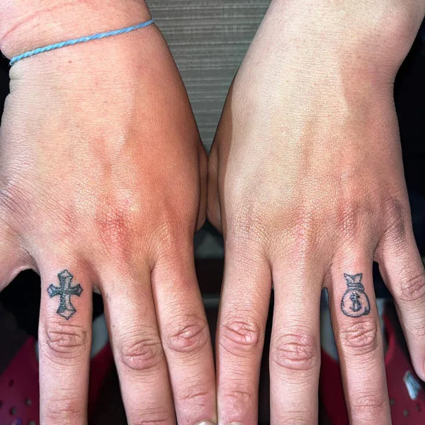 Money bag tattoo on finger
