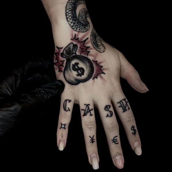 Money bag tattoo on hand