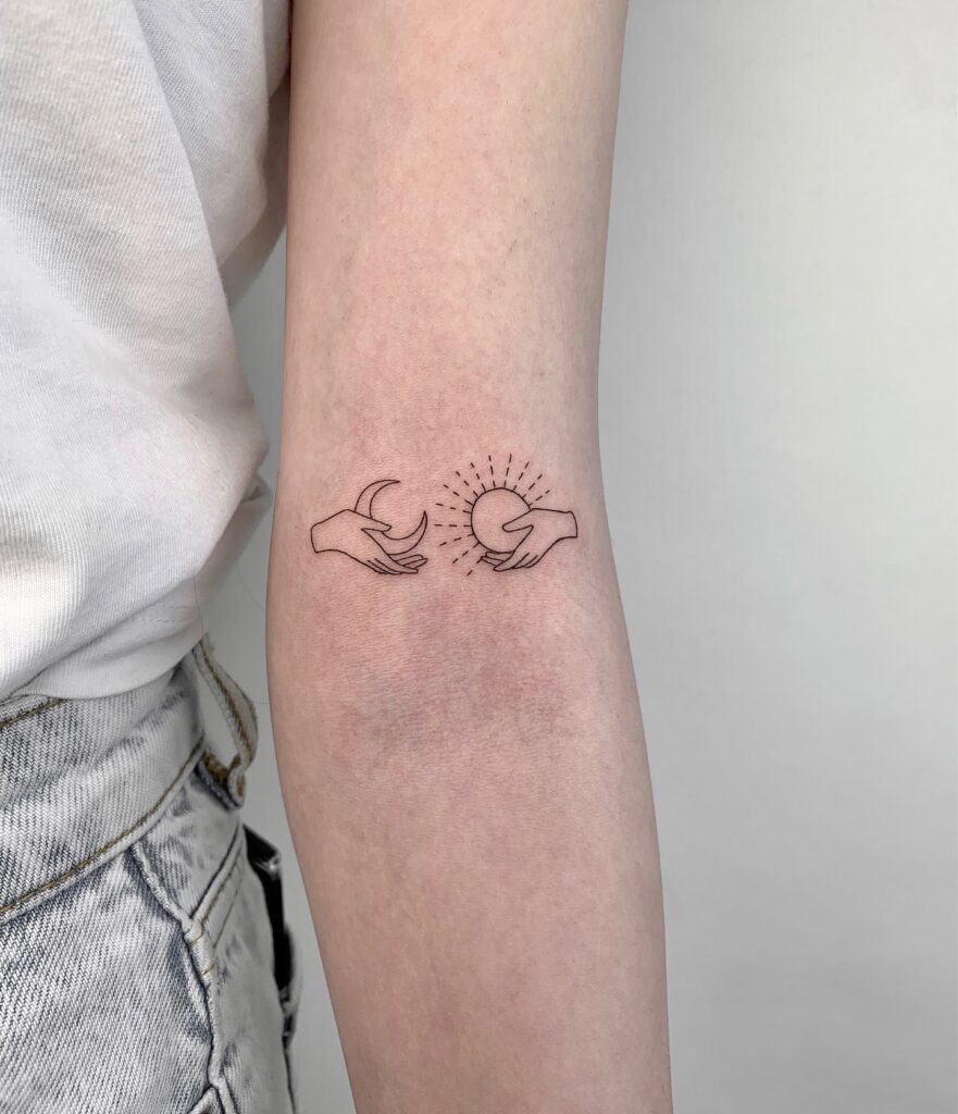 Moon and Sun in Hands Above the Elbow: Celestial Embrace