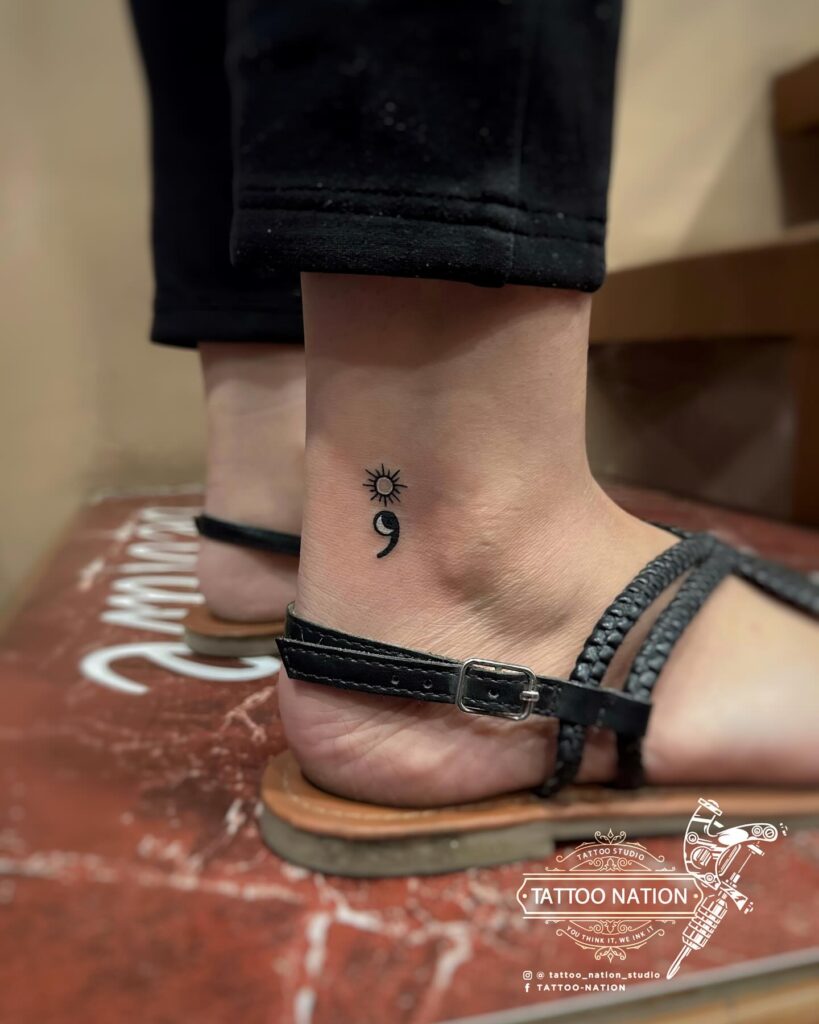 Moon and Sun Semicolon Tattoo Near the Ankle: Celestial Fusion