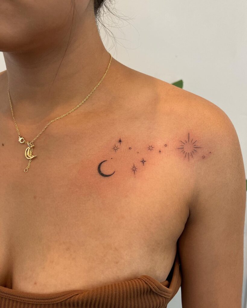 Moonlit beauty small thin stars and moon tattoo on the female shoulder