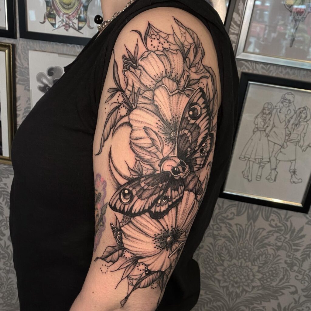 Moth and wildflowers feminine half sleeve: natural beauty and transformation