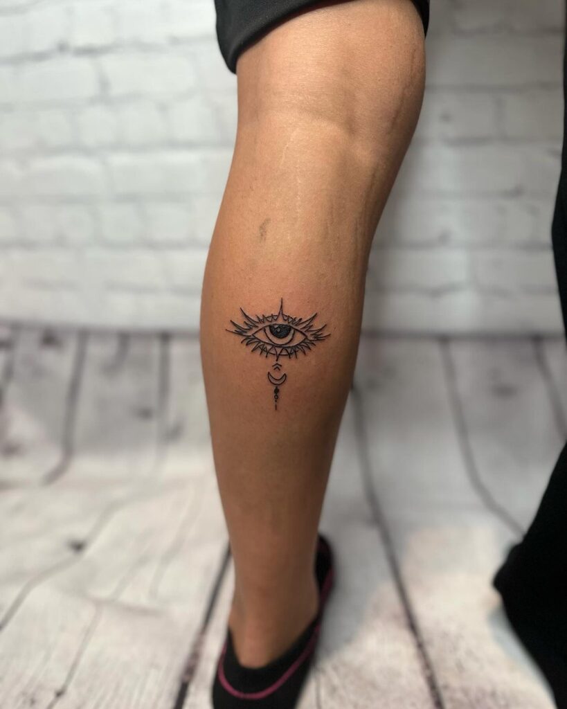 Mystical all-seeing eye calf tattoo design for symbolic beauty 