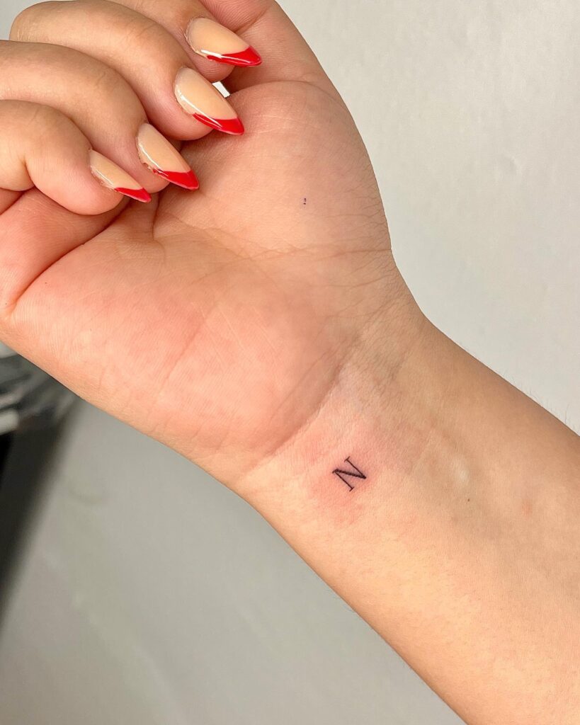 'N' Letter Tattoo with Elegance on the Inner Wrist: Fineline Initials