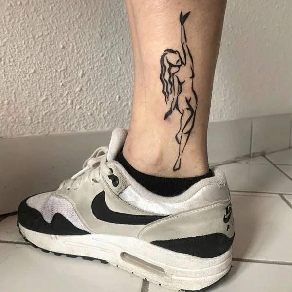 Naked women leg tattoo