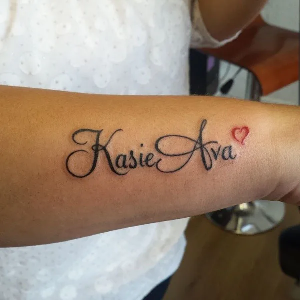 Name tattoo on arm