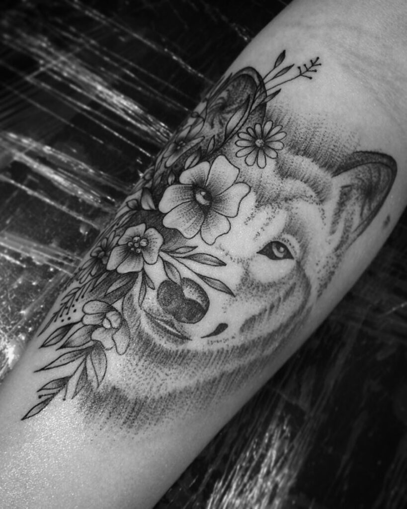 Nature's harmony the beautiful forearm wolf amongst flowers