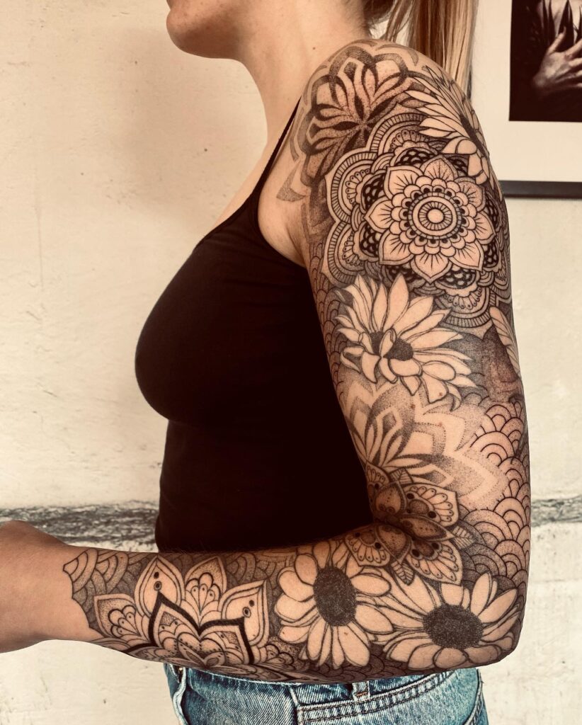 Neo-traditional full-sleeve tattoo with skull and panther