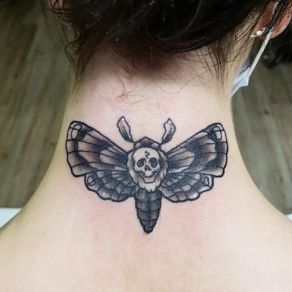 Nighttime enigma deaths head moth tattoo quietly on the nape