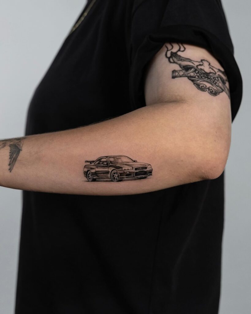 Nissan Skyline GT-R R34 Tattoo with Realistic Shading on Forearm – Car Tattoo Ideas
